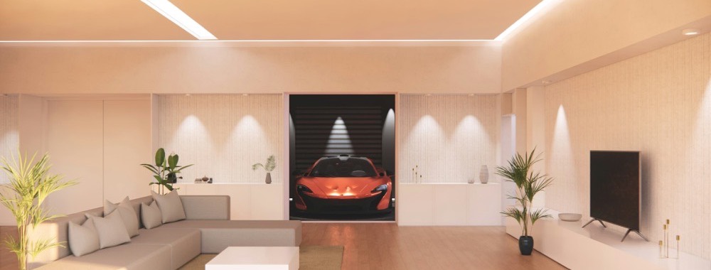 Living room with ambient cove lighting and wall-mounted TV